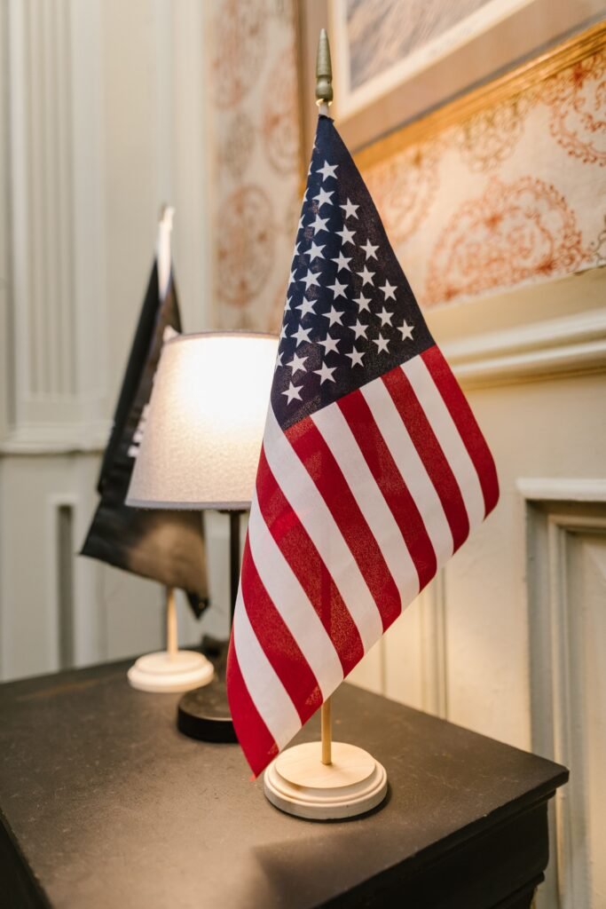 American flag on a desk representing an O-1 visa agent filing a petition