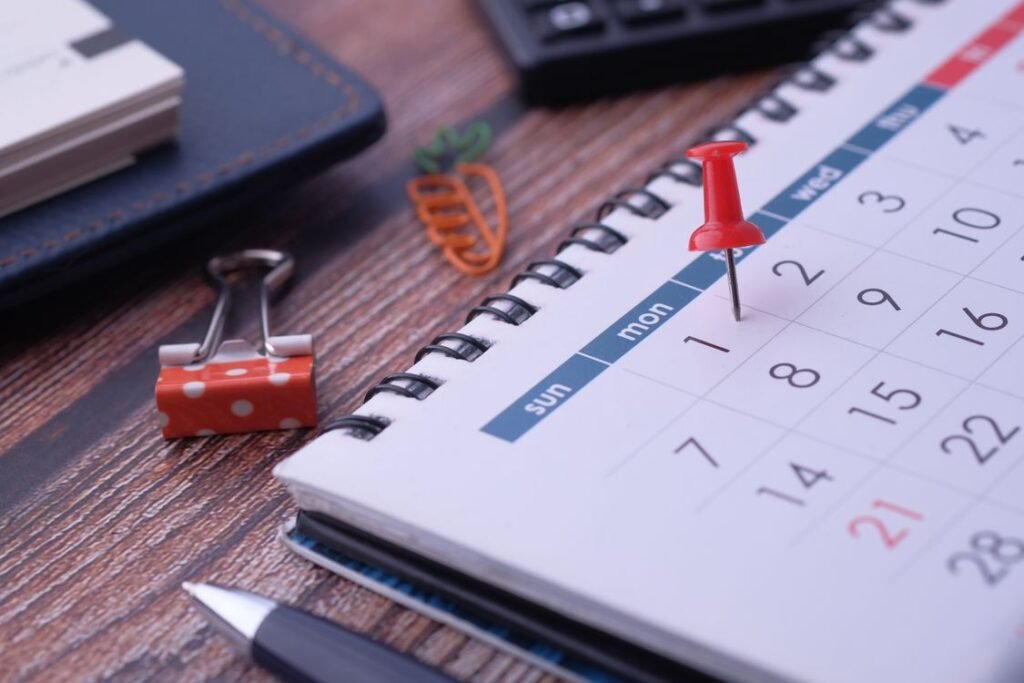 Calendar with a pin marking dates, representing an O-1 visa agent itinerary